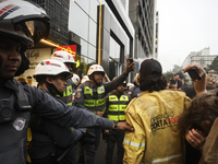 Protesters hold a demonstration against the fires and the climate situation in Brazil and for agrarian reform on Avenida Paulista, in the ce...