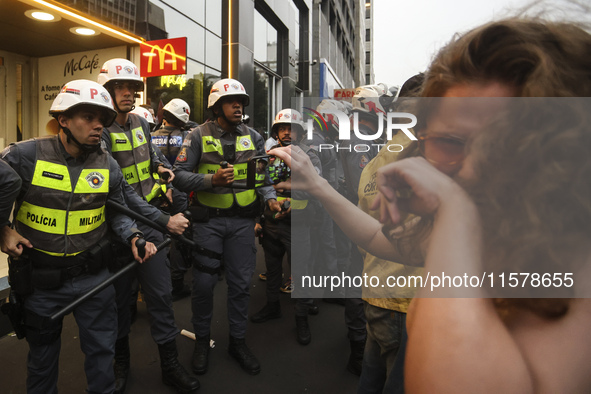 Protesters hold a demonstration against the fires and the climate situation in Brazil and for agrarian reform on Avenida Paulista, in the ce...