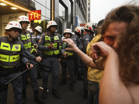 Protesters hold a demonstration against the fires and the climate situation in Brazil and for agrarian reform on Avenida Paulista, in the ce...