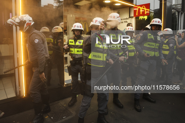 Protesters hold a demonstration against the fires and the climate situation in Brazil and for agrarian reform on Avenida Paulista, in the ce...