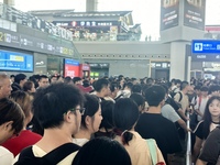 A large number of tourists prepare to travel at Chengdu East Railway Station on the first day of the Mid-Autumn Festival holiday in Chengdu,...