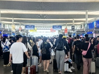 A large number of tourists prepare to travel at Chengdu East Railway Station on the first day of the Mid-Autumn Festival holiday in Chengdu,...