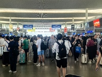 A large number of tourists prepare to travel at Chengdu East Railway Station on the first day of the Mid-Autumn Festival holiday in Chengdu,...