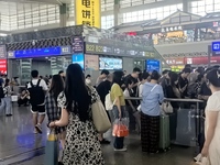 A large number of tourists prepare to travel at Chengdu East Railway Station on the first day of the Mid-Autumn Festival holiday in Chengdu,...