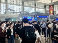 A large number of tourists prepare to travel at Chengdu East Railway Station on the first day of the Mid-Autumn Festival holiday in Chengdu,...