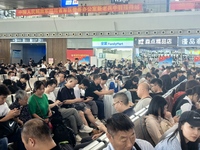 A large number of tourists prepare to travel at Chengdu East Railway Station on the first day of the Mid-Autumn Festival holiday in Chengdu,...