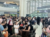 A large number of tourists prepare to travel at Chengdu East Railway Station on the first day of the Mid-Autumn Festival holiday in Chengdu,...