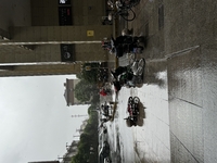 Electric bikes are blown down during strong winds and rain as Typhoon Bebika makes landfall in Shanghai, China, on September 16, 2024. (