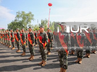 New recruits attend a send-off ceremony for the 2024 autumn Army recruits in Lianyungang, China, on September 16, 2024. (