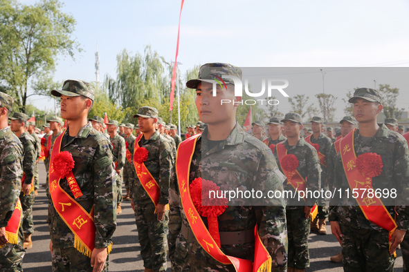 New recruits attend a send-off ceremony for the 2024 autumn Army recruits in Lianyungang, China, on September 16, 2024. 