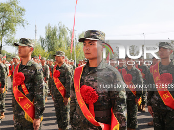 New recruits attend a send-off ceremony for the 2024 autumn Army recruits in Lianyungang, China, on September 16, 2024. (