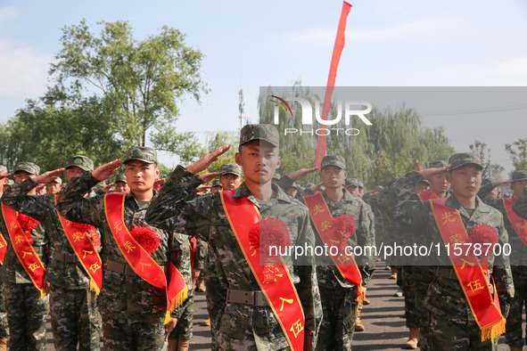 New recruits attend a send-off ceremony for the 2024 autumn Army recruits in Lianyungang, China, on September 16, 2024. 