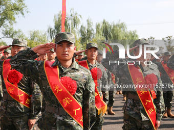 New recruits attend a send-off ceremony for the 2024 autumn Army recruits in Lianyungang, China, on September 16, 2024. (