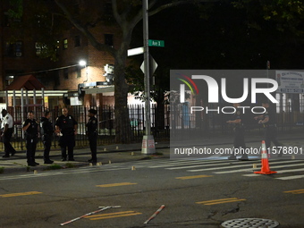 Police place evidence markers and set up crime scene tape at the scene where two people are shot. Two people are shot in Brooklyn, New York,...