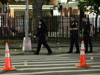 Police place evidence markers and set up crime scene tape at the scene where two people are shot. Two people are shot in Brooklyn, New York,...