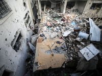 Palestinians inspect a house hit in an Israeli strike in Nuseirat, Gaza Strip, on September 16, 2024, amid the ongoing war between Israel an...