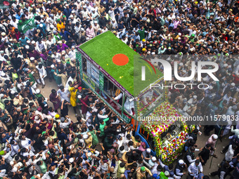 Muslims take part in a procession on the occasion of Eid Milad-un-Nabi, the birth anniversary of Prophet Muhammad, in Chittagong, Bangladesh...