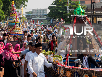 Hundreds of Muslims participate in the boat procession tradition, known as 'Kirab Perahu,' during the Prophet Muhammad's birthday celebratio...