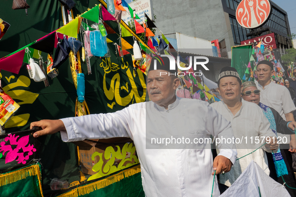 Hundreds of Muslims participate in the boat procession tradition, known as 'Kirab Perahu,' during the Prophet Muhammad's birthday celebratio...