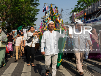 Hundreds of Muslims participate in the boat procession tradition, known as 'Kirab Perahu,' during the Prophet Muhammad's birthday celebratio...