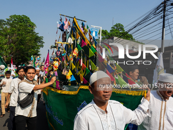 Hundreds of Muslims participate in the boat procession tradition, known as 'Kirab Perahu,' during the Prophet Muhammad's birthday celebratio...