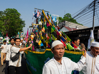 Hundreds of Muslims participate in the boat procession tradition, known as 'Kirab Perahu,' during the Prophet Muhammad's birthday celebratio...