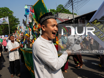 Hundreds of Muslims participate in the boat procession tradition, known as 'Kirab Perahu,' during the Prophet Muhammad's birthday celebratio...