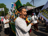 Hundreds of Muslims participate in the boat procession tradition, known as 'Kirab Perahu,' during the Prophet Muhammad's birthday celebratio...