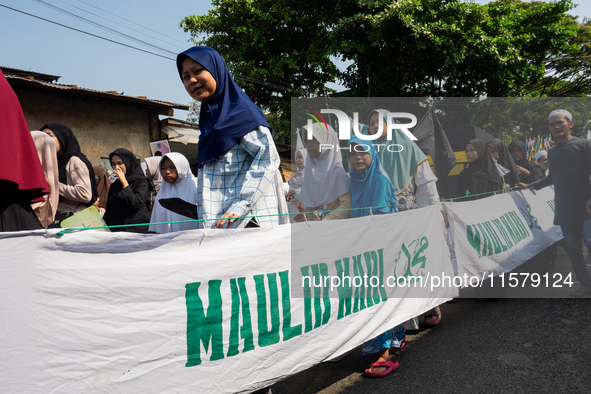 Hundreds of Muslims participate in the boat procession tradition, known as 'Kirab Perahu,' during the Prophet Muhammad's birthday celebratio...