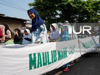 Hundreds of Muslims participate in the boat procession tradition, known as 'Kirab Perahu,' during the Prophet Muhammad's birthday celebratio...