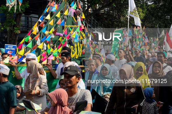 Hundreds of Muslims participate in the boat procession tradition, known as 'Kirab Perahu,' during the Prophet Muhammad's birthday celebratio...