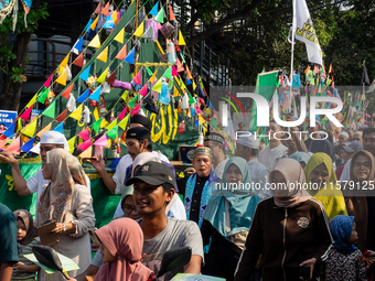 Hundreds of Muslims participate in the boat procession tradition, known as 'Kirab Perahu,' during the Prophet Muhammad's birthday celebratio...