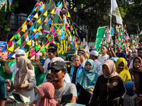 Hundreds of Muslims participate in the boat procession tradition, known as 'Kirab Perahu,' during the Prophet Muhammad's birthday celebratio...