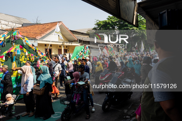 Hundreds of Muslims participate in the boat procession tradition, known as 'Kirab Perahu,' during the Prophet Muhammad's birthday celebratio...