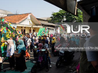 Hundreds of Muslims participate in the boat procession tradition, known as 'Kirab Perahu,' during the Prophet Muhammad's birthday celebratio...