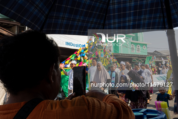 Hundreds of Muslims participate in the boat procession tradition, known as 'Kirab Perahu,' during the Prophet Muhammad's birthday celebratio...