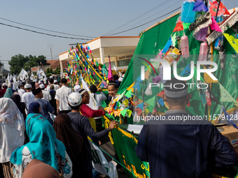 Hundreds of Muslims participate in the boat procession tradition, known as 'Kirab Perahu,' during the Prophet Muhammad's birthday celebratio...