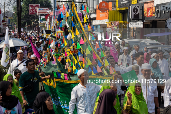 Hundreds of Muslims participate in the boat procession tradition, known as 'Kirab Perahu,' during the Prophet Muhammad's birthday celebratio...