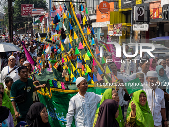 Hundreds of Muslims participate in the boat procession tradition, known as 'Kirab Perahu,' during the Prophet Muhammad's birthday celebratio...