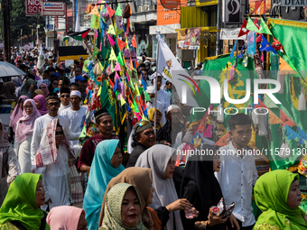 Hundreds of Muslims participate in the boat procession tradition, known as 'Kirab Perahu,' during the Prophet Muhammad's birthday celebratio...