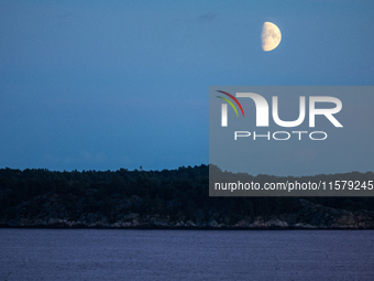 A view of the first quarter of moon (illumination: 63%) in Kristiansand, Norway, on September 12, 2024. (