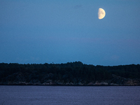 A view of the first quarter of moon (illumination: 63%) in Kristiansand, Norway, on September 12, 2024. (