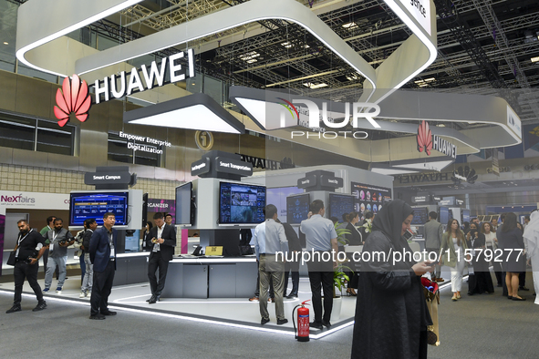 People visit the Huawei pavilion at the ConteQ Expo24 (Advanced Technology for Construction & Services Expo) at the Qatar National Conventio...