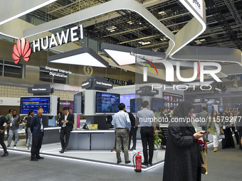 People visit the Huawei pavilion at the ConteQ Expo24 (Advanced Technology for Construction & Services Expo) at the Qatar National Conventio...