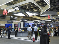 People visit the Huawei pavilion at the ConteQ Expo24 (Advanced Technology for Construction & Services Expo) at the Qatar National Conventio...