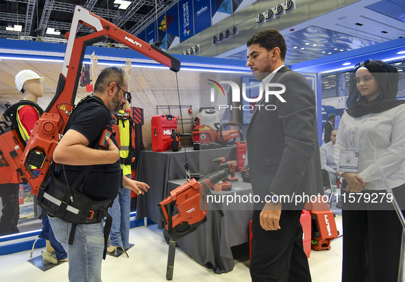 People watch the performance at the Hilti Pavilion during ConteQ Expo24 (Advanced Technology for Construction & Services Expo) at the Qatar...