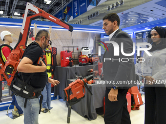 People watch the performance at the Hilti Pavilion during ConteQ Expo24 (Advanced Technology for Construction & Services Expo) at the Qatar...