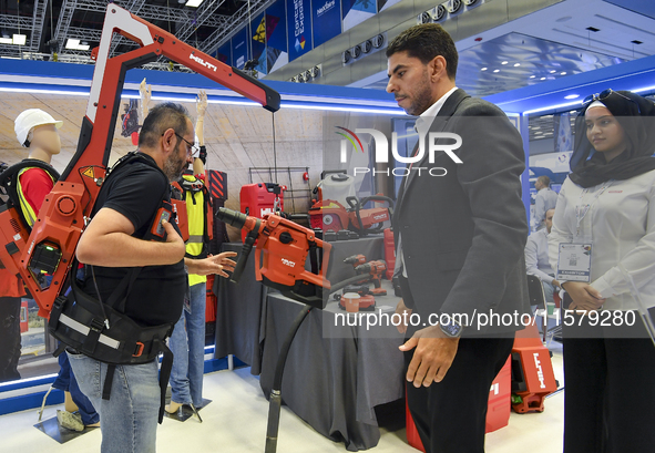 People watch the performance at the Hilti Pavilion during ConteQ Expo24 (Advanced Technology for Construction & Services Expo) at the Qatar...