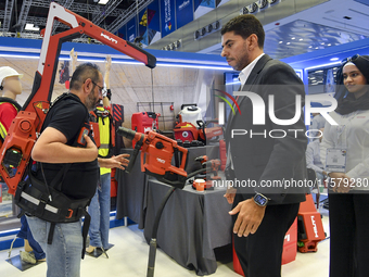 People watch the performance at the Hilti Pavilion during ConteQ Expo24 (Advanced Technology for Construction & Services Expo) at the Qatar...