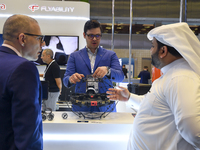 People visit the ConteQ Expo24 (Advanced Technology for Construction & Services Expo) at the Qatar National Convention Centre (QNCC) in Doha...